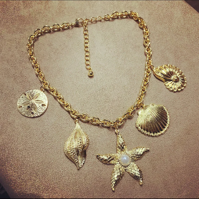 Ladies brilliant Swarovski necklaces -Kenneth Jay Lane Sea Shell gold charm necklace