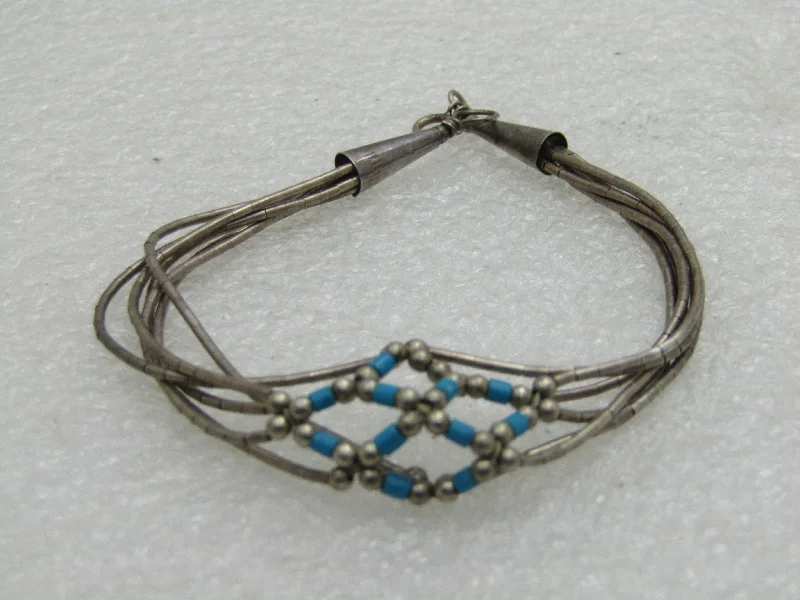 Ladies native tribal bracelets -Vintage Southwestern Liquid Silver Turquoise Bracelet, 6 Stands, 7"