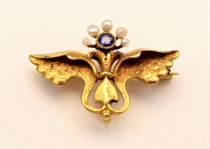 ladies silver brooch amethyst stones -14K yellow gold Mercury-themed brooch with one Sapphire and 5 seed pearls