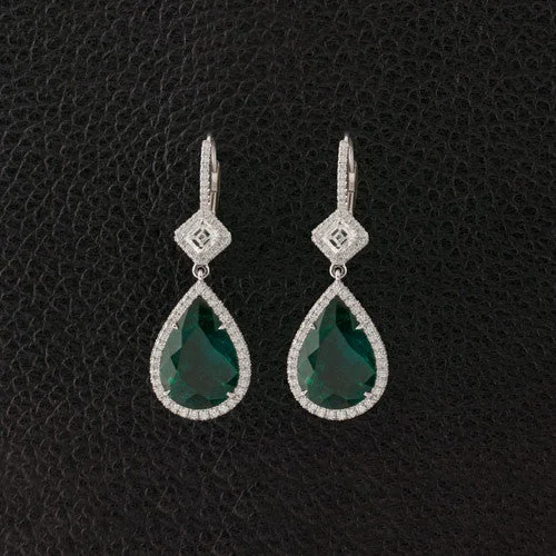 ladies gold earrings feather accents -Emerald & Diamond Dangle Earrings