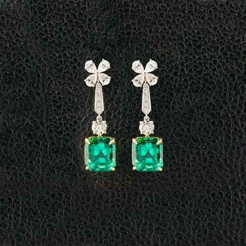 ladies gold earrings wave patterns -Emerald & Diamond Dangle Earrings